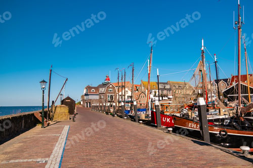 Preview: Urk Flevoland Netherlands sunset at the lighthouse and harbor of Urk Holland