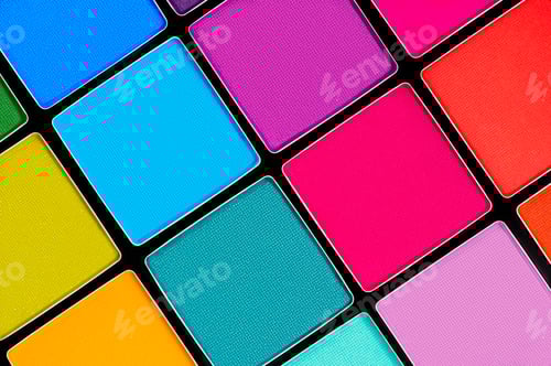 Preview: Palette of bright eyeshadow close-up.