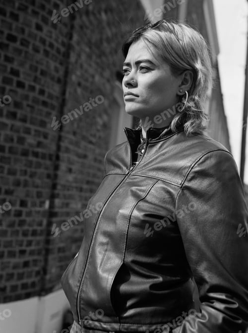 Preview: Analog side view portrait of woman posing in the street.