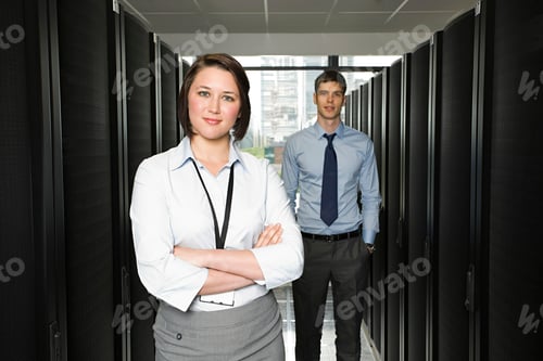 Preview: Confident professionals standing in a server room.