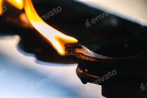 Preview: Burning clay oil lamps, glowing with the wind in the dark, offering light to Lord Buddha