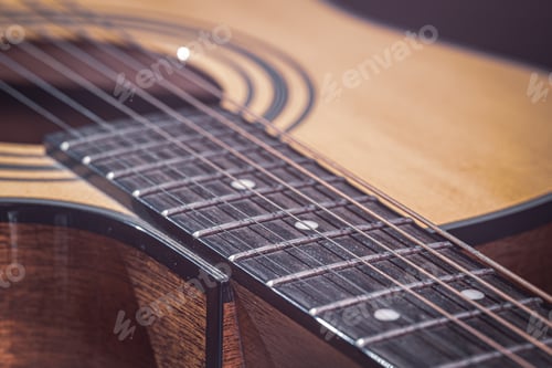 Preview: Close-up of a classical acoustic guitar in beautiful lighting.