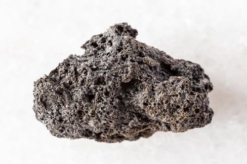 Preview: sample of raw pumice rock on white marble