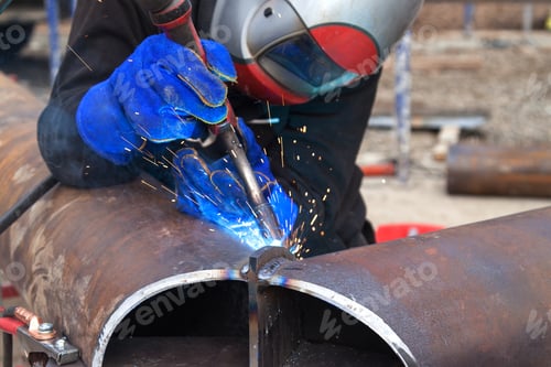 Preview: Welding work, welder welding metal material in heavy industry manufacturing
