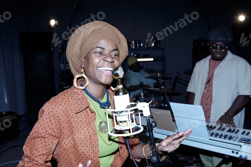 Preview: Smiling African American Woman Singing in Recording Studio