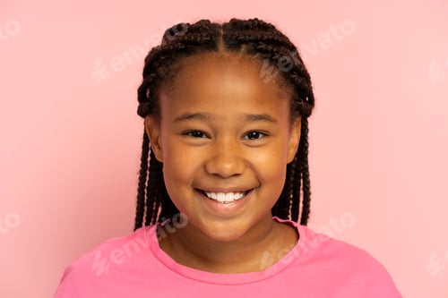 Preview: Portrait of cute smiling African American girl wearing stylish hairstyle, dreadlocks