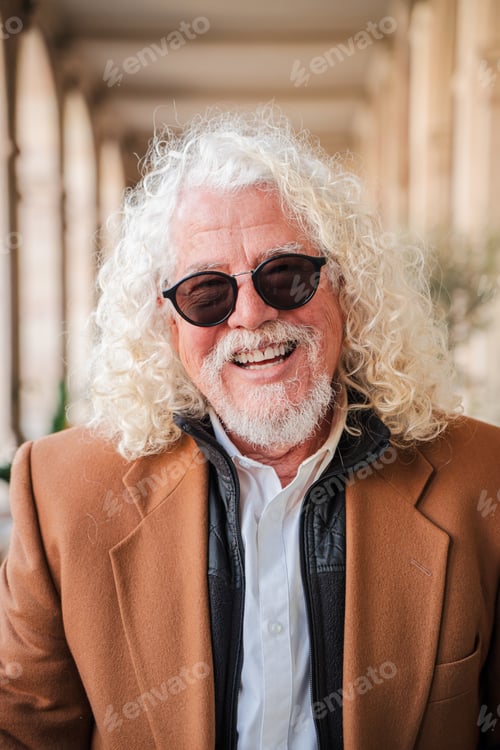 Preview: Joyful elderly man with a bright smile and lively personality engaging with the camera