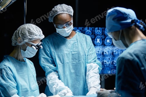 Preview: Surgeons Performing Operation with Medical Imaging Monitor