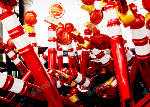 Preview: Traffic pylons and warning lights piled in up a heap.