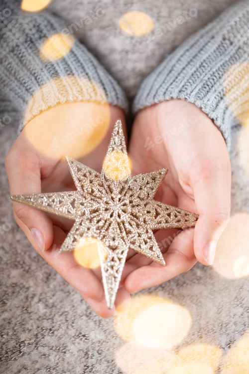 Preview: Winter Concept Young Hands Holding christmas decor.