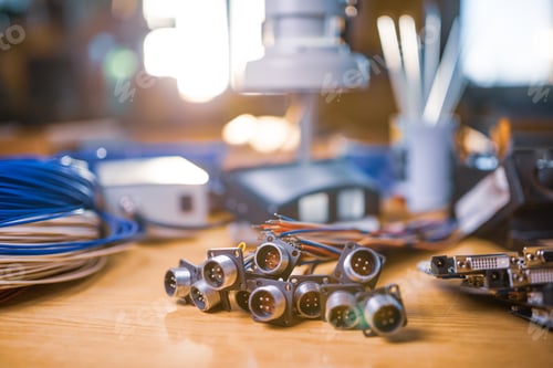 Preview: Close-up blurry metal sockets for plugs are in a heap