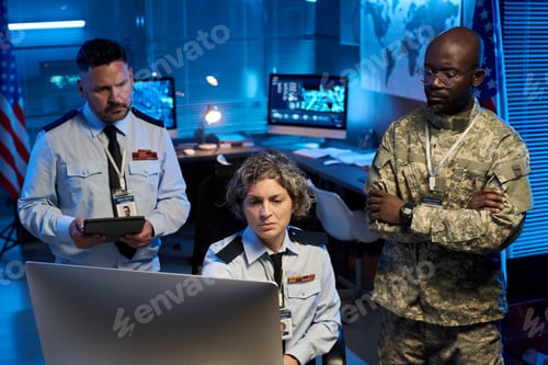 Preview: Colleagues looking at computer screen