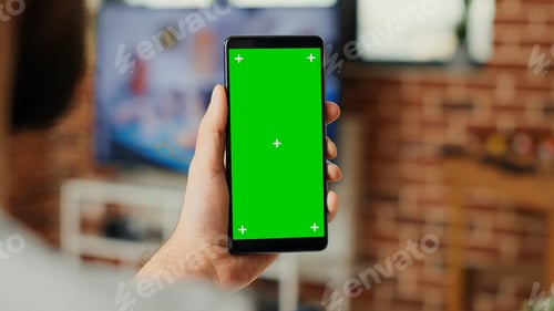 Preview: Office worker working with greenscreen template on mobile phone