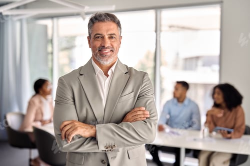 Preview: Confident senior Indian business man leader standing at office meeting. Portrait