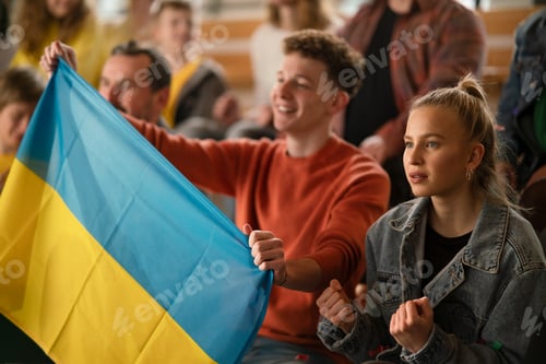 Preview: Ukrainian fans supproting national team in live match at stadium.