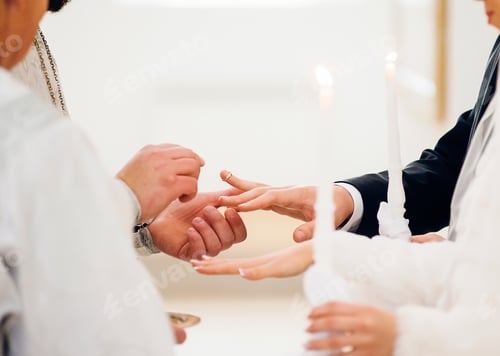 Preview: The priest puts on the ring at the wedding ceremony in the church