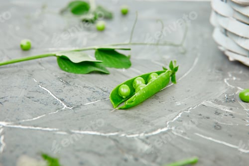 Preview: White Basket with fresh green peas on grey background.