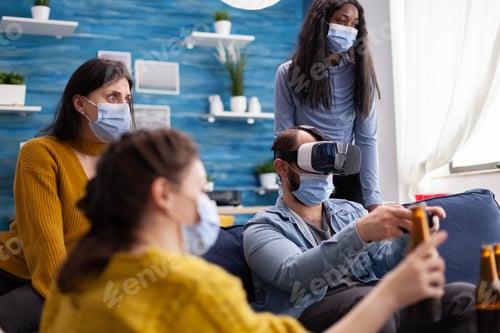 Preview: Group of multi ethnic friends having fun playing video games
