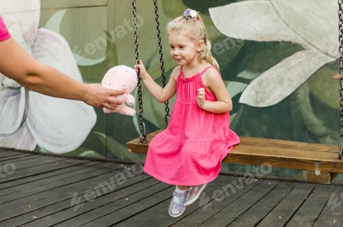 Preview: Funny baby with cochlear implant walks outdoor. Hearing aid and medicine innovating technology