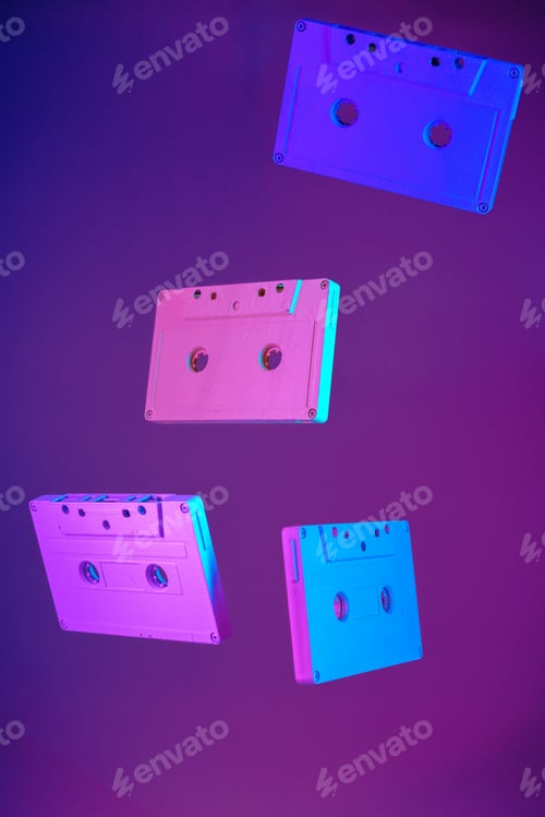 Preview: Cassette tape vintage style suspended in air on purple background