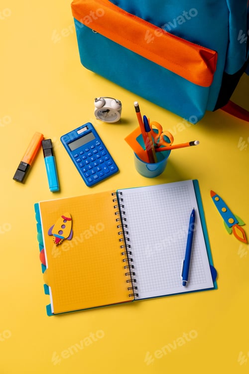 Preview: School backpack with colorful school supplies on yellow background.