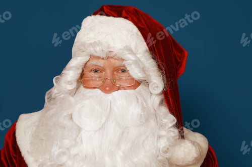 Preview: Happy authentic Santa Claus on blue background