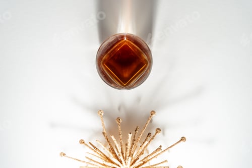 Preview: Still-life with a glass of bourbon on white background