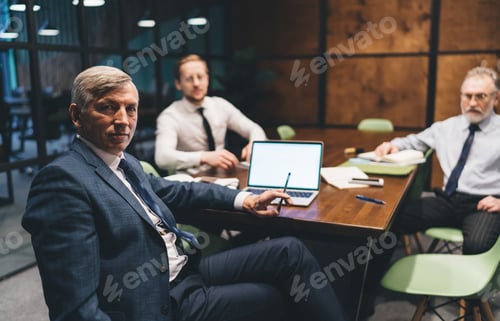 Preview: Thoughtful colleagues having meeting in workspace