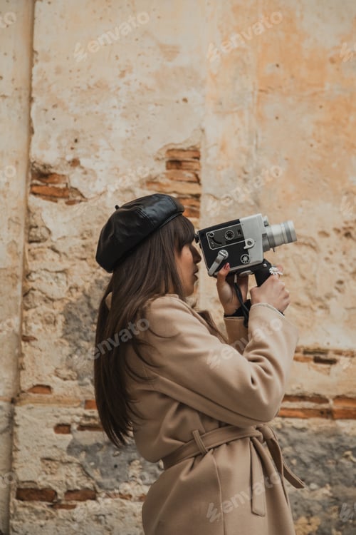 Preview: Woman Using A Vintage Film Camera Outdoor In A Small Italian Town