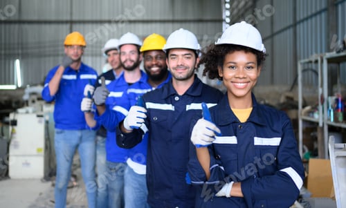 Preview: Group of confident worker team at factory