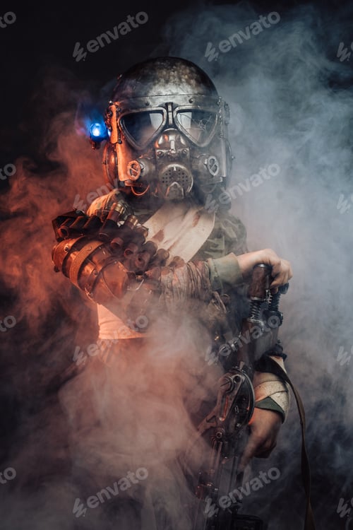 Preview: Young soldier in gas mask and armed with riffle in smoke