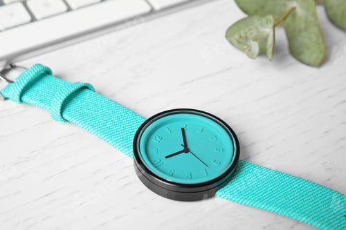 Preview: Stylish wrist watch on wooden table. Fashion accessory