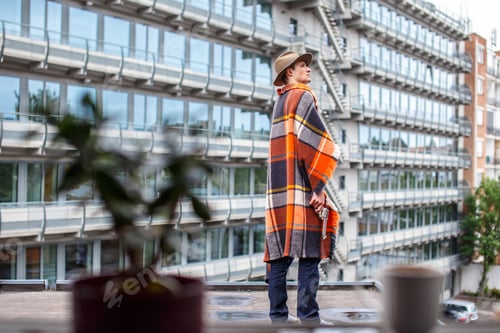 Preview: Freezed man covered with blanket.