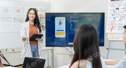 Preview: Business woman present project form monitor and tablet Startup team working in office