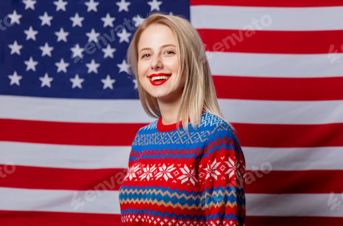 Preview: Beautiful blonde in Christmas sweater on USA flag background