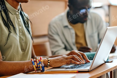Preview: Student using laptop at her study