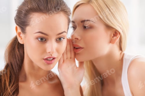 Preview: No way news. Beautiful young blond hair woman whispering something to her surprised friend