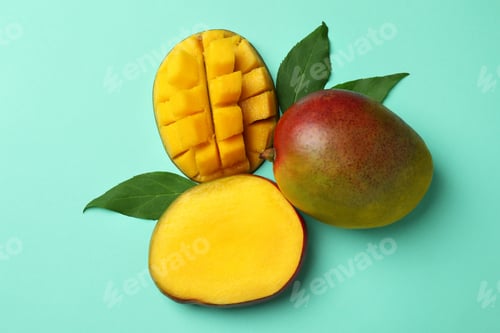 Preview: Tasty ripe mango fruit on mint background