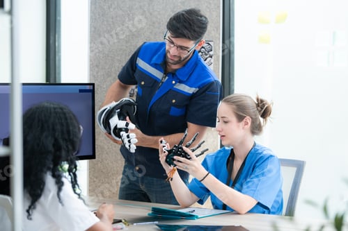 Preview: Engineers, doctors and physical therapists brainstorm ideas to design a robot with arm and hand