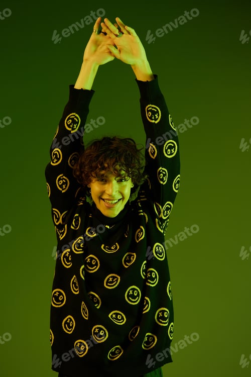 Preview: Man fashion and style accessories model with curly hair stylish sweater, hipster dance smile hands