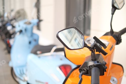 Preview: Colorful scooters are parked in a lively urban setting, adding vibrancy to the streets
