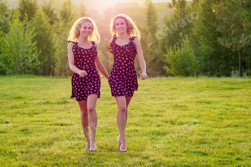 Preview: two sisters twins beautiful curly blonde happy young toothy smile women