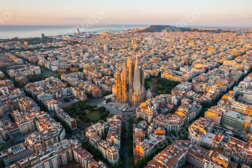 Preview: Aerial view of Barcelona Eixample residential district and Sagrada Familia Basilica at sunrise