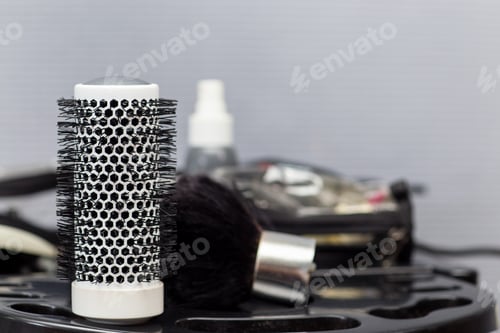 Preview: Comb and other hairdresser's tools and accessories on table, horizontal, copy space
