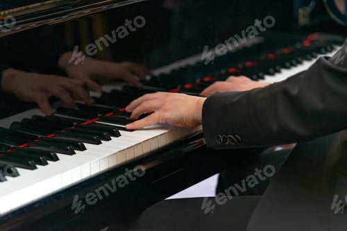 Preview: close up of male hands playing piano close up