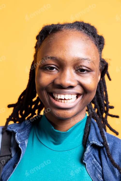 Preview: Portrait of cheerful girl smiling, feeling delighted, studio background