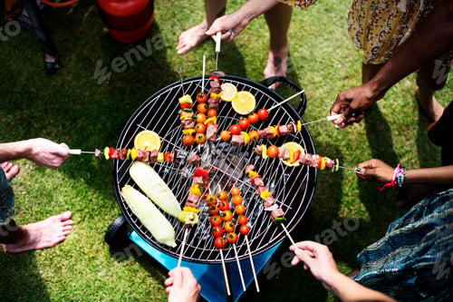 Preview: Aerial view of a diverse group of friends grilling barbecue outdoors