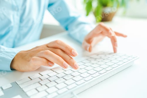 Preview: Woman office worker typing on the keyboard