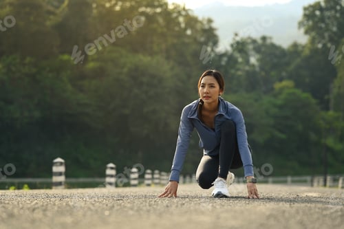 Preview: Young sportswoman in starting position, Make effort for victory, Fitness, sport and healthy.