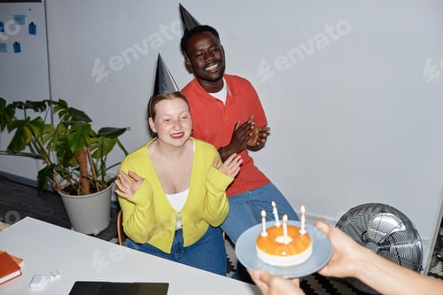 Preview: People celebrating birthday in office with flash